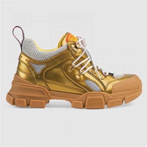 gucci flashtrek gold shoes.